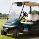 golf cart parked in grass