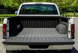 loading a golf cart onto a truck bed