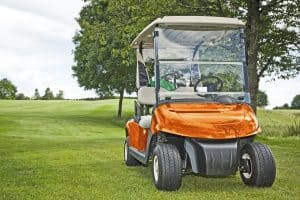 golf cart parked on grass