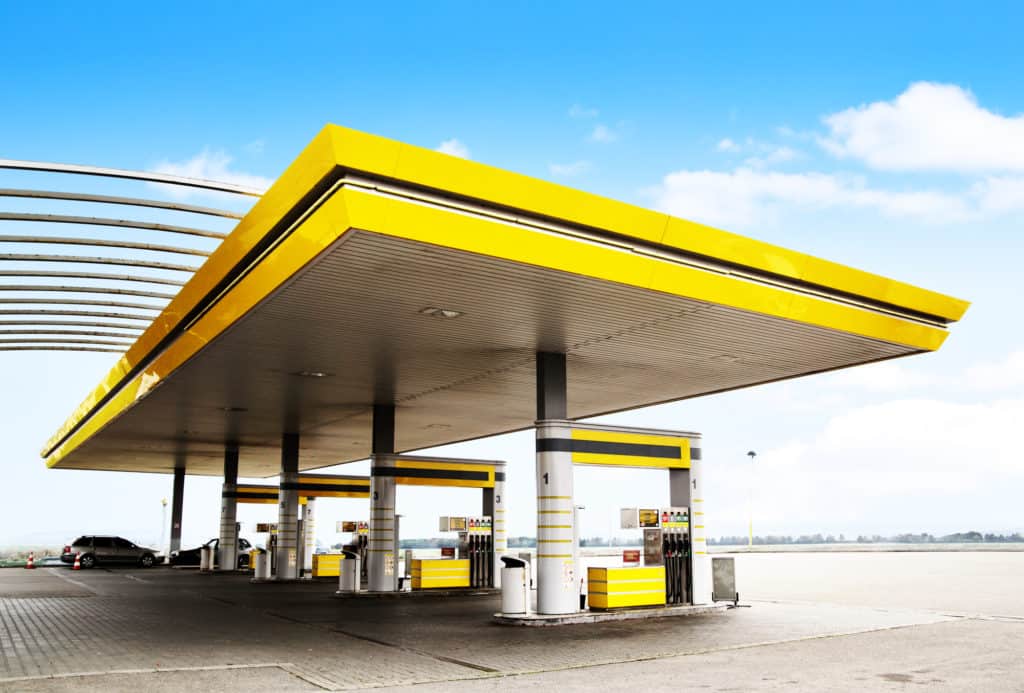 Gas refuel station with yellow roof close-up