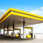 Gas refuel station with yellow roof close-up