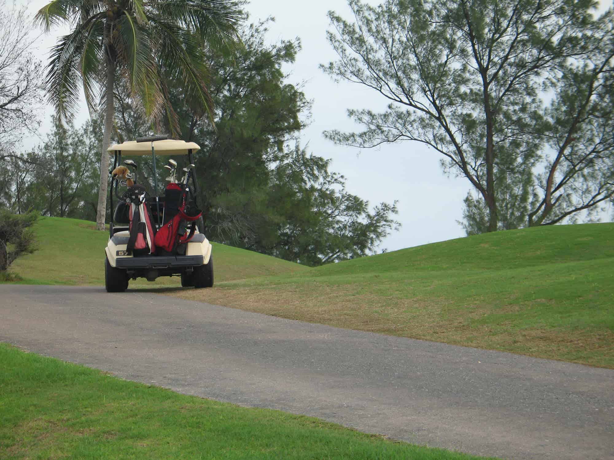 golf cart sitting on top of a hill