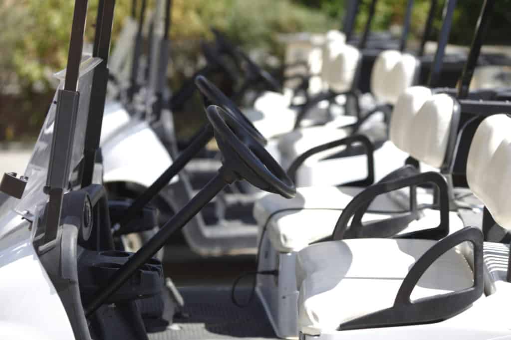 A number of the club car golf carts at the golf course