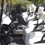 A number of the club car golf carts at the golf course