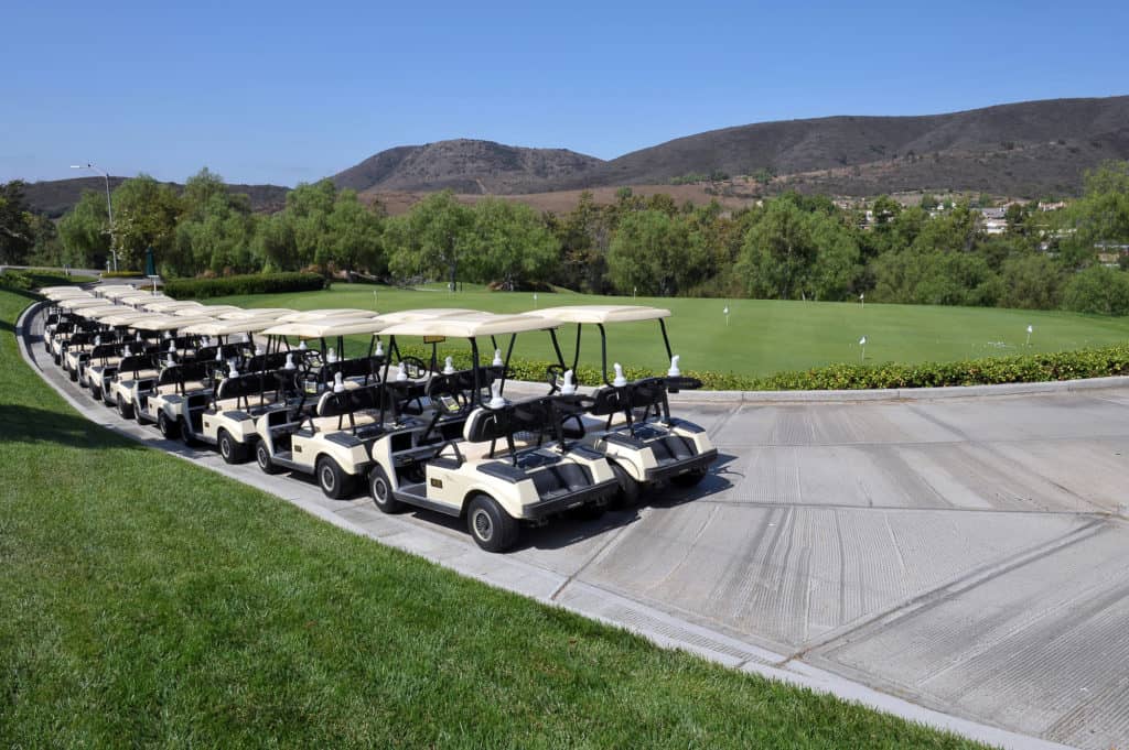 Golf carts lined up in a row