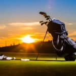 Golf club and Golf ball in bag on grass