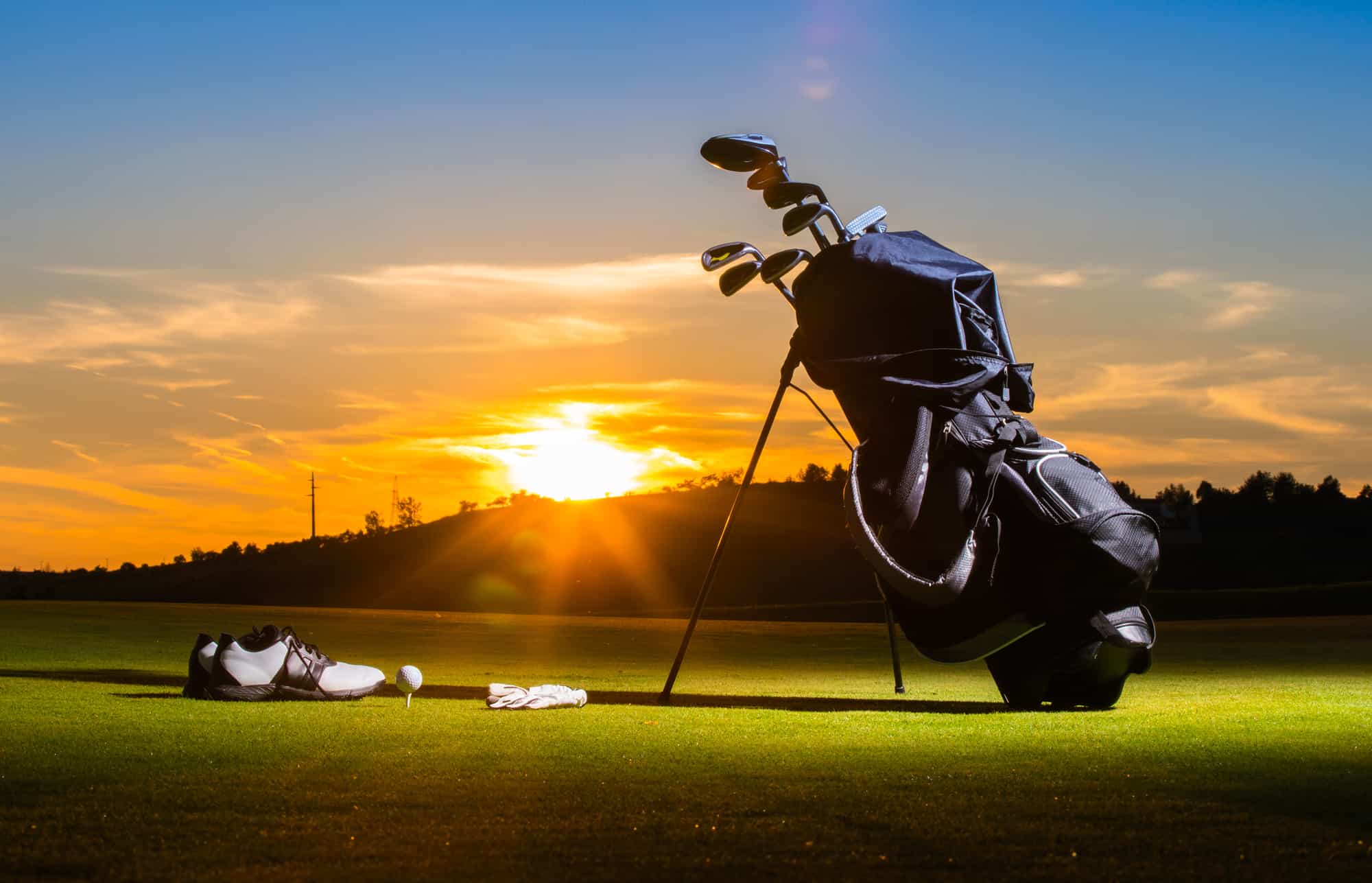 Golf club and Golf ball in bag on grass