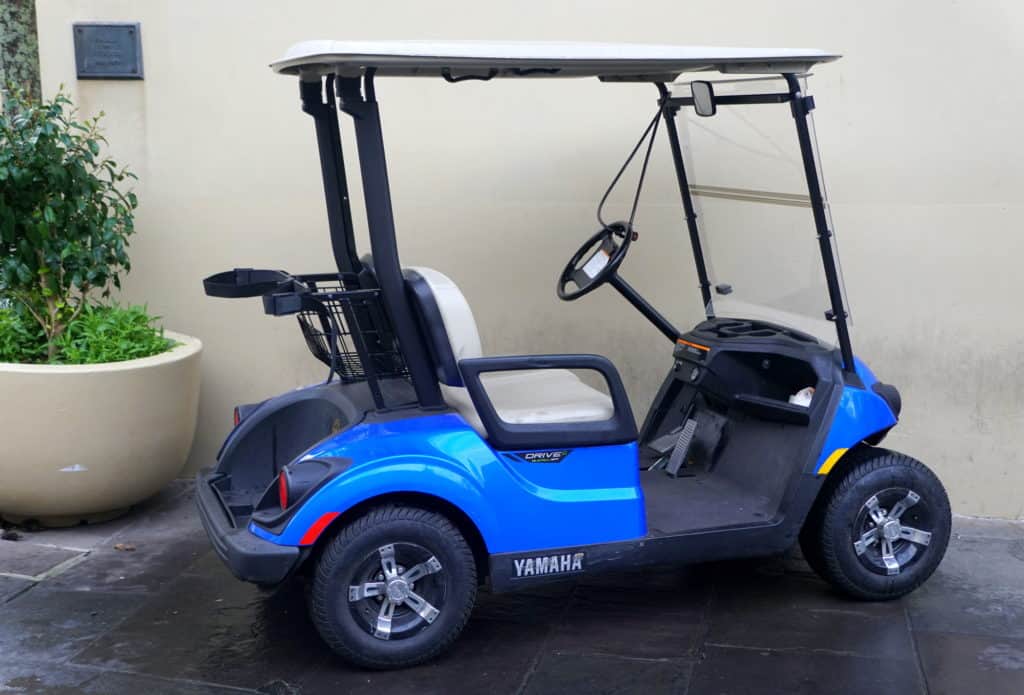 New Orleans, Louisiana, U.S.A - February 4, 2020 - A blue color of an electric golf cart by Yamaha