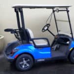 New Orleans, Louisiana, U.S.A - February 4, 2020 - A blue color of an electric golf cart by Yamaha