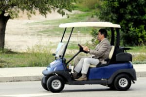 PIERCE BROSNAN IN A GOLF CART FOR THE STREETS OF CAMP DE MAR IN MALLORCA. OCTOBER 2012