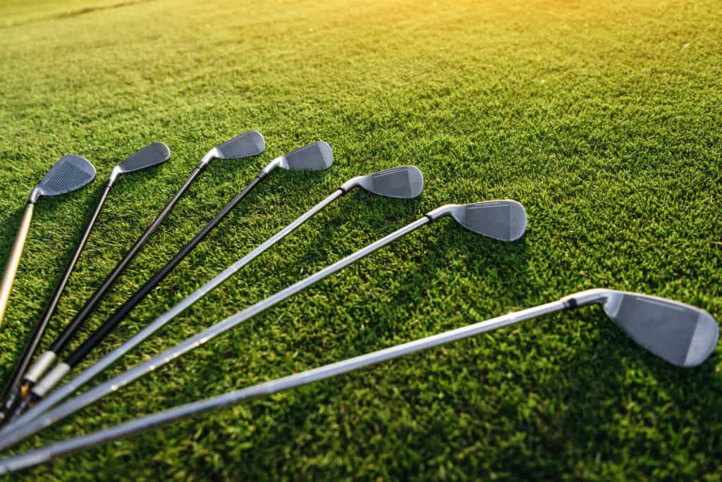 Golf Clubs laying on grass