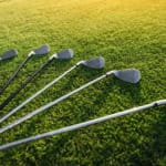 Golf Clubs laying on grass
