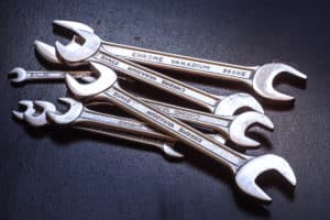 Set of the stainless steel wrench on dark background