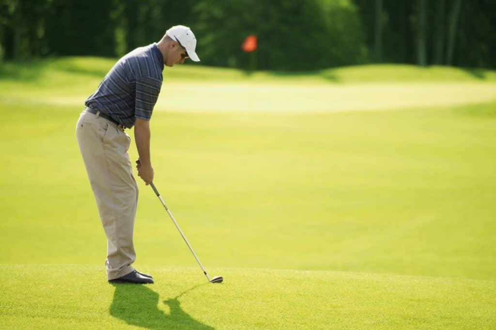 golfer looking at putting green