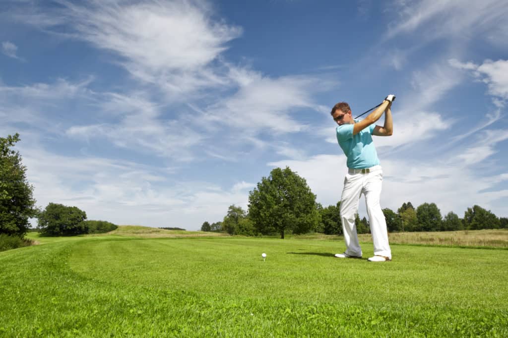 An image of a young male golf player