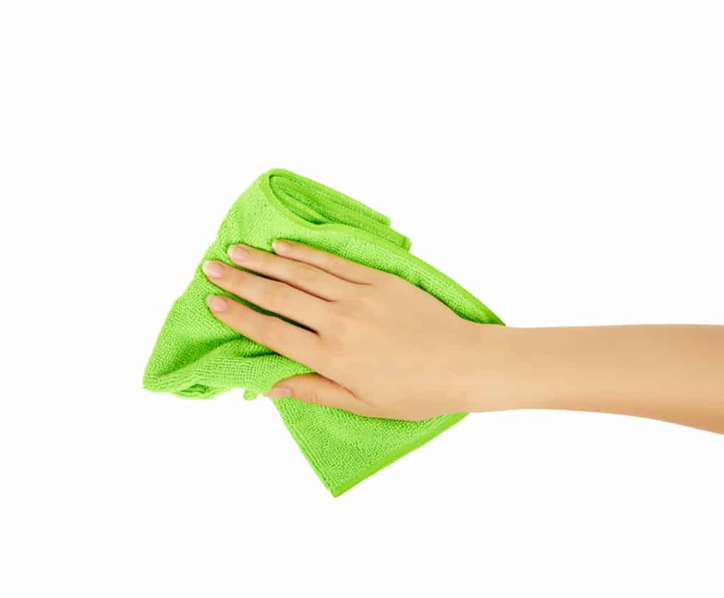 hand holding a sponge isolated on white background