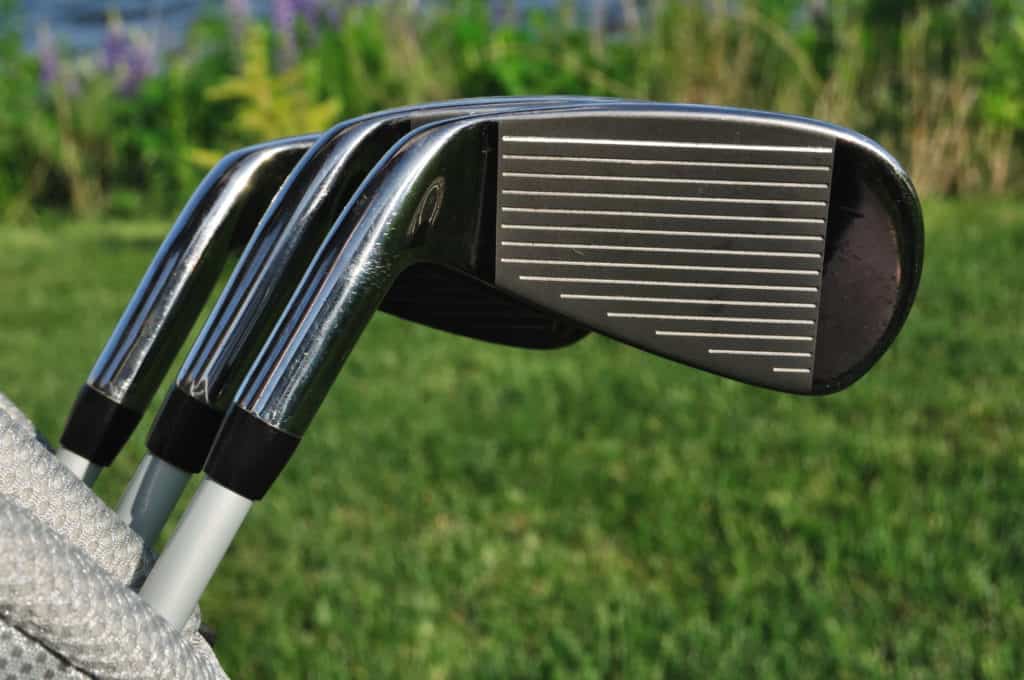 Close up of Three Irons (Clubs) in a Golf Bag