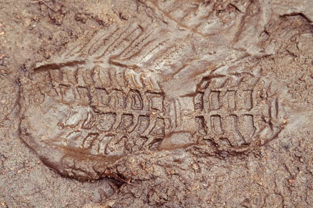 Boot print in brown mud