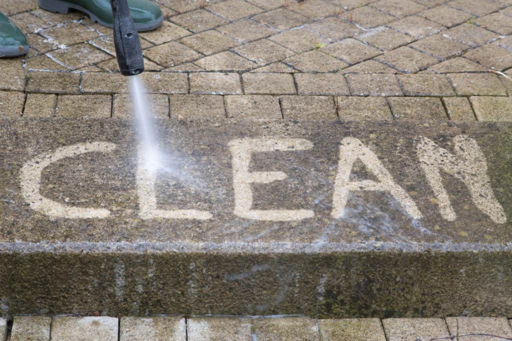 Outdoor floor cleaning with high pressure water jet