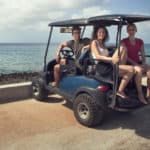 Tree Tourists Traveling with a Golf Cart in San Andres, Colimbia