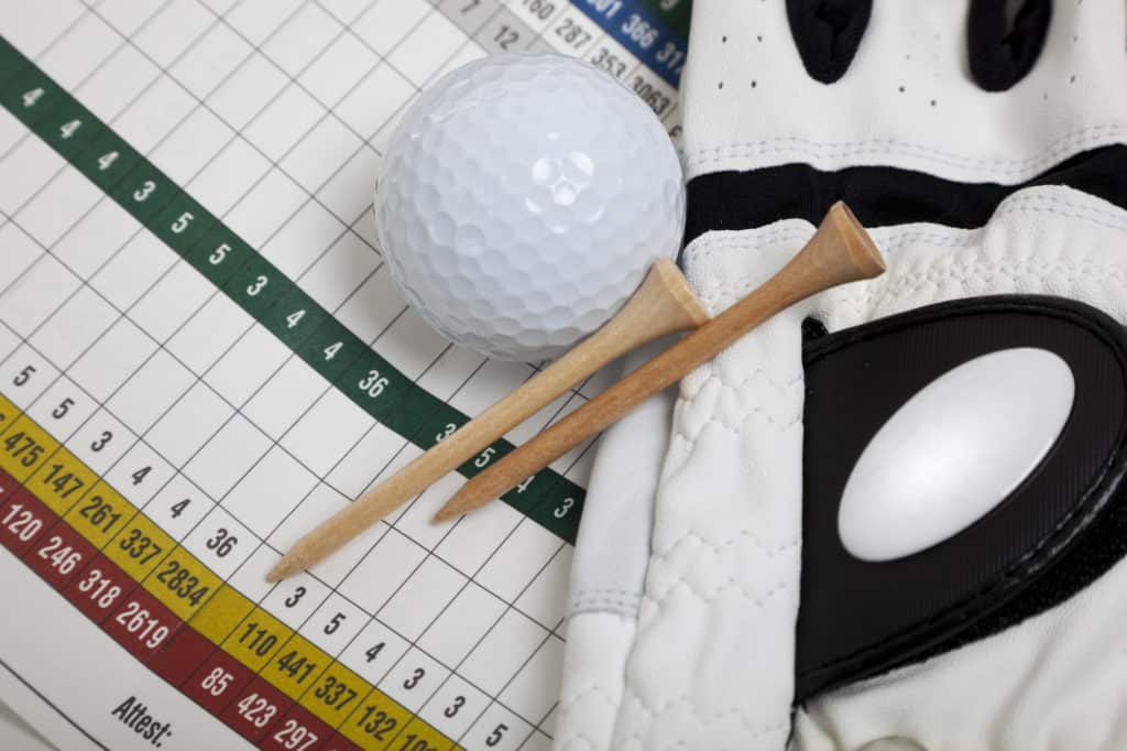golf glove, tees and a golf ball. Sports, golf concept