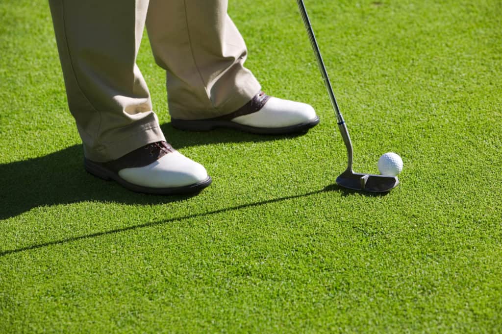 Close-up of man playing golf