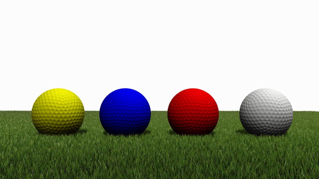 3d rendered of colored golfball on green grass with white background