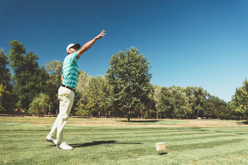 Golfer checking the wind