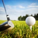 Playing golf. Golf club and ball. Preparing to shot