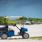 Photo of a golf cart on the beach shot with telephoto lens USA