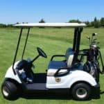 golf cart on golf course grass