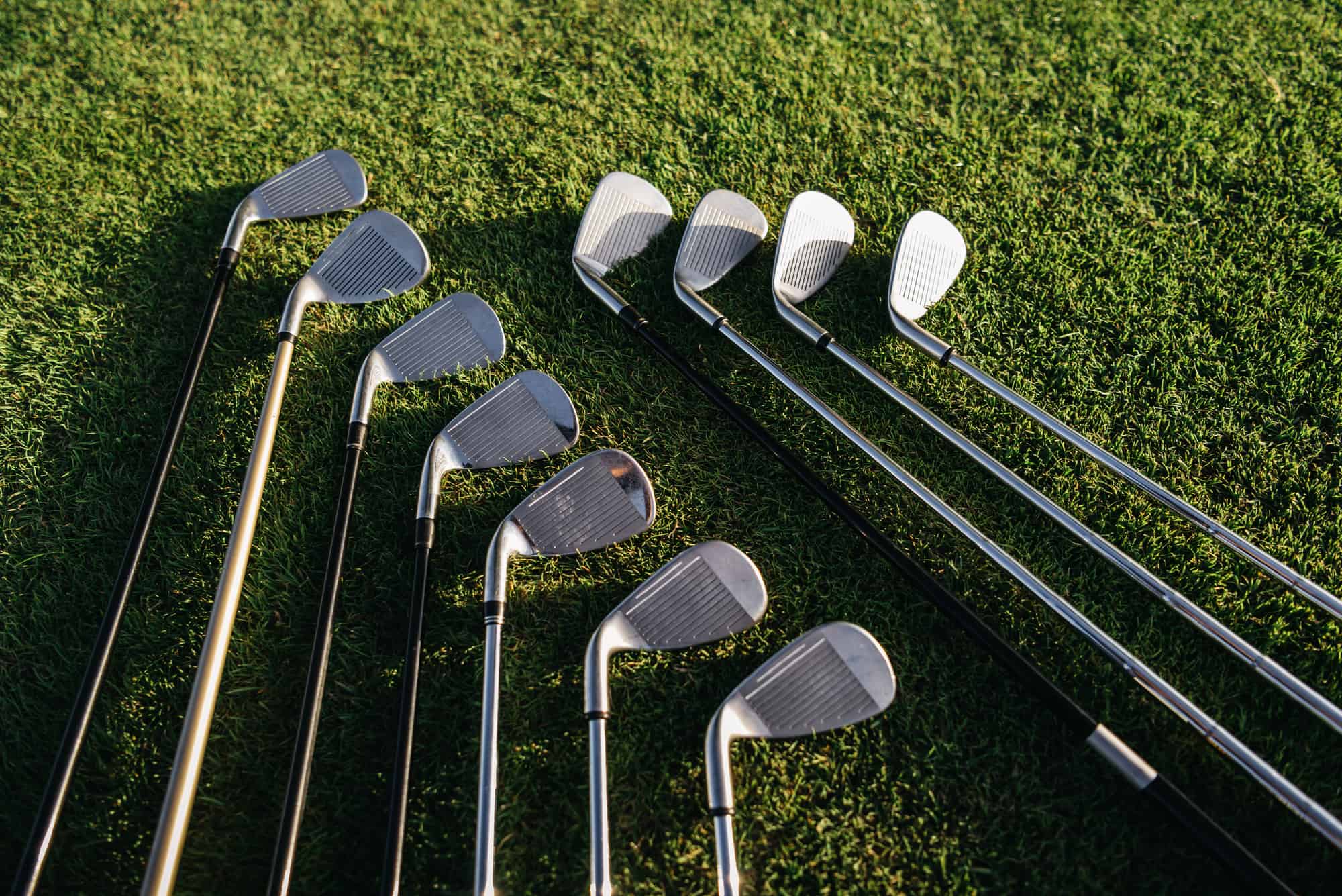 golf clubs on grass