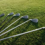 golf clubs on grass lying