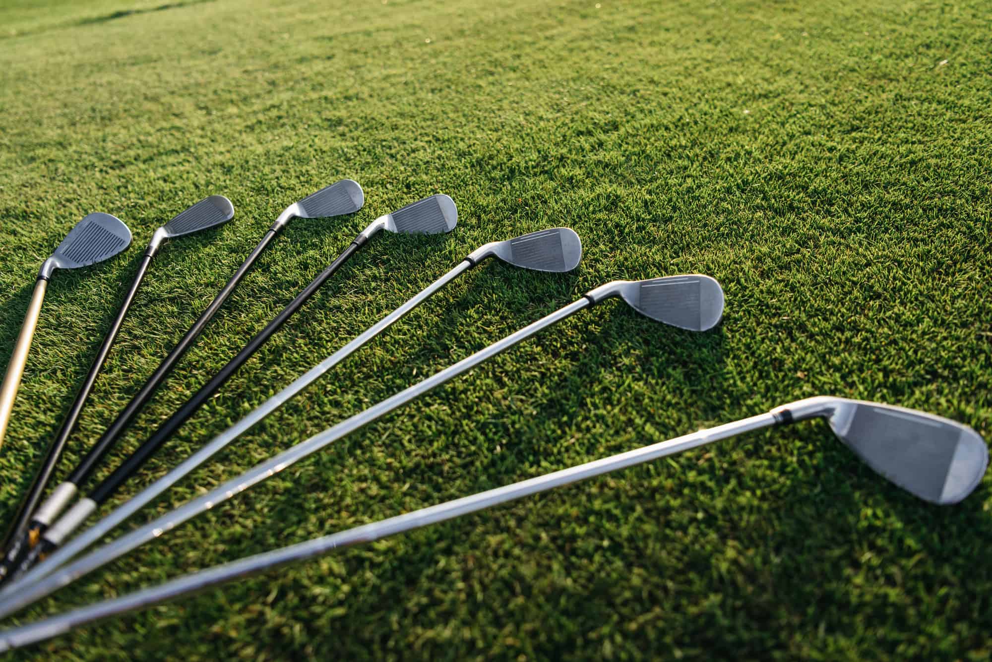 golf clubs on grass lying