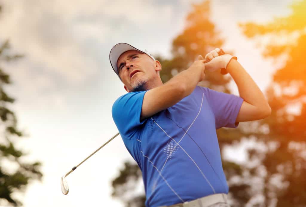 golfer shooting a golf ball