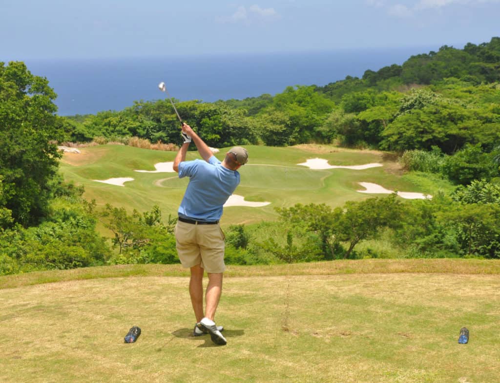 Golfer trying a par 3 on a course in Jamaica