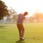 blurred golfers hit sweeping and keep golf course in the summer for relax time