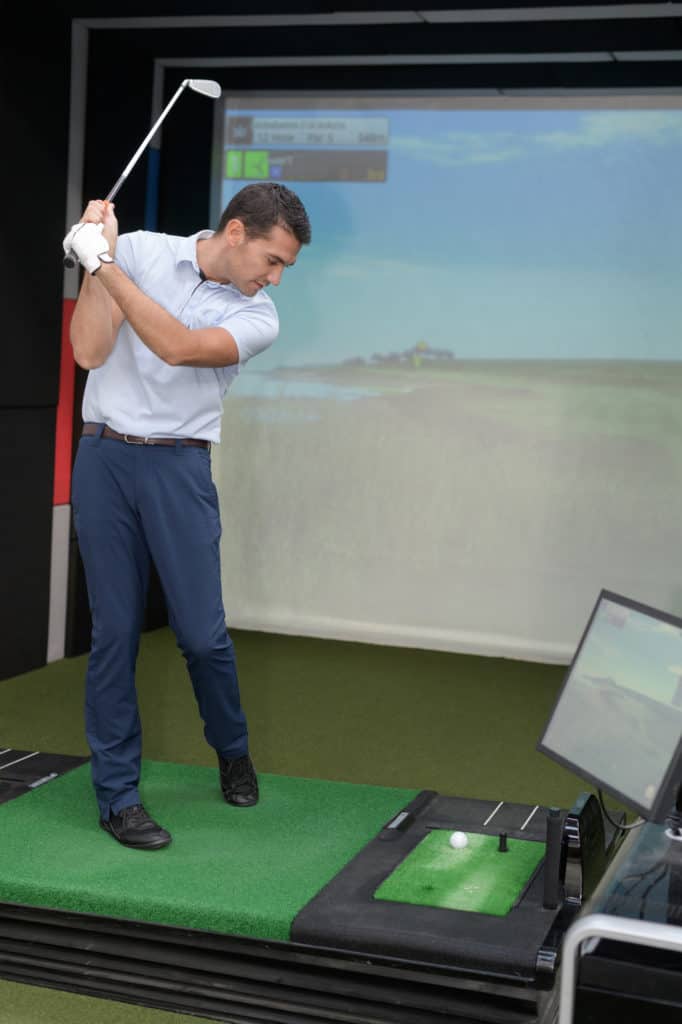 man playing golf video-game