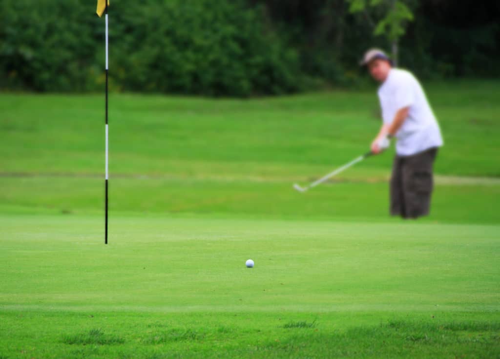 playing golf on green