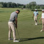 young friends playing golf