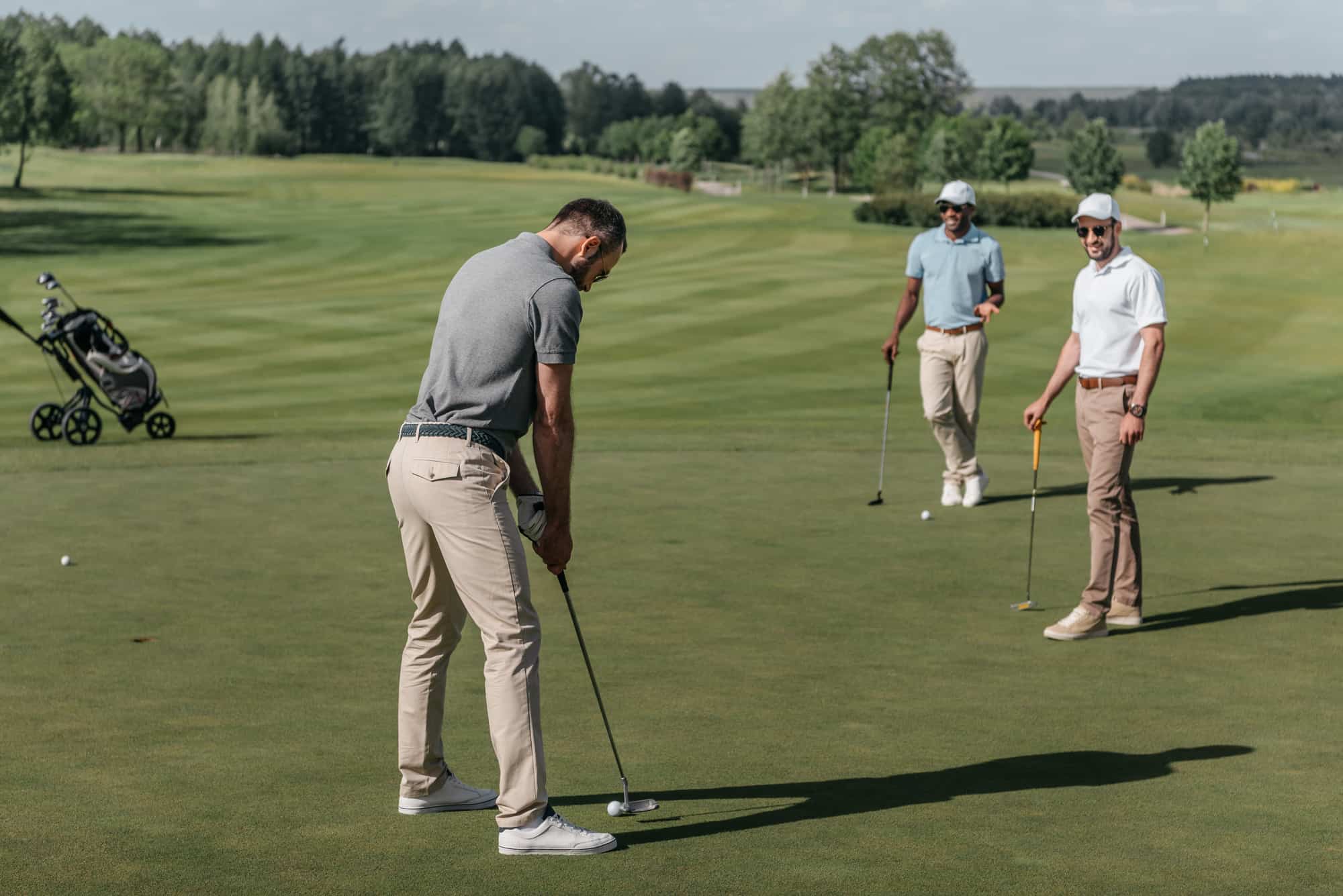 young friends playing golf