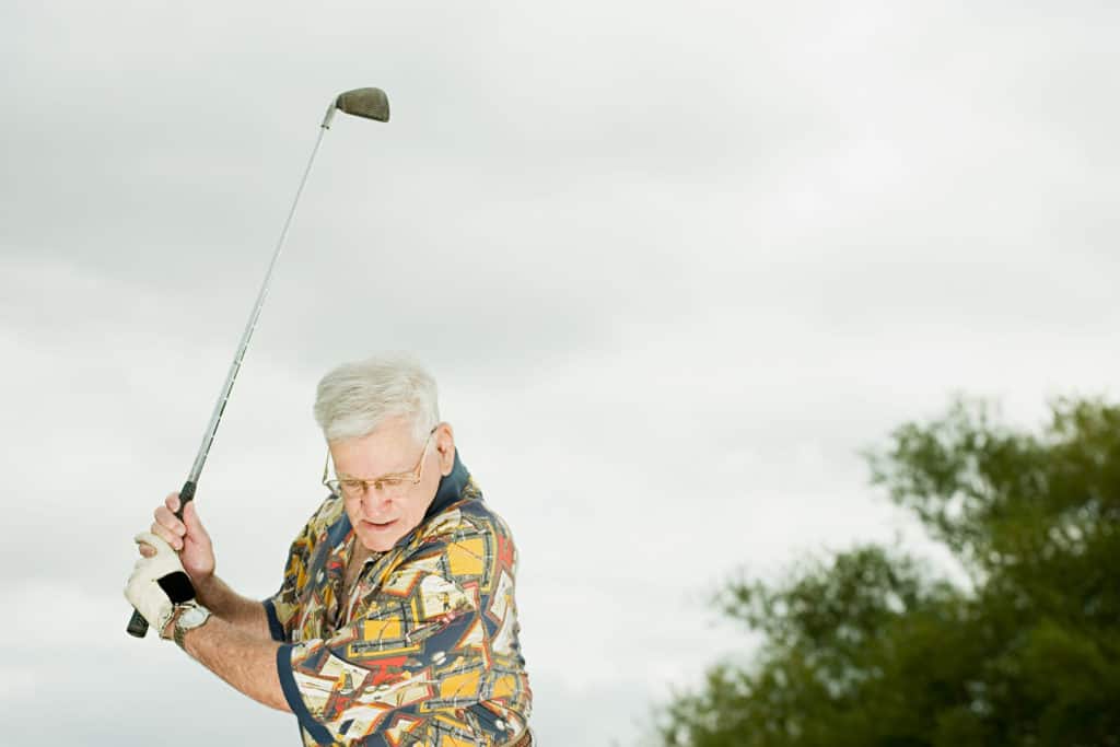 Senior man playing golf