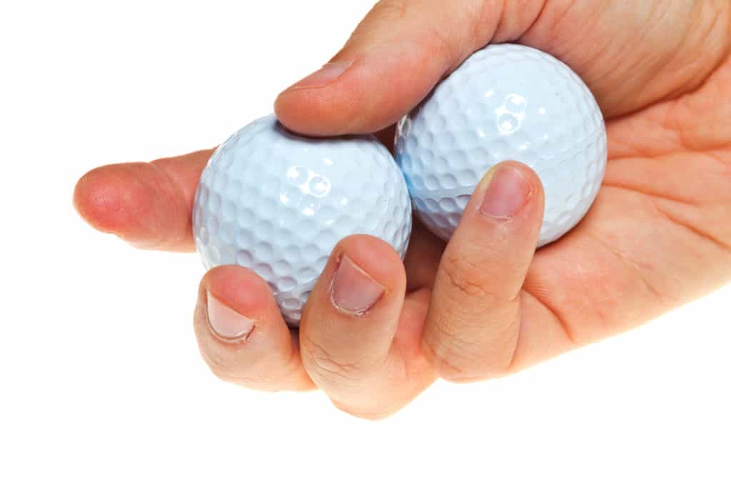 Golf balls in hand