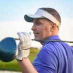 Golf player holding driver