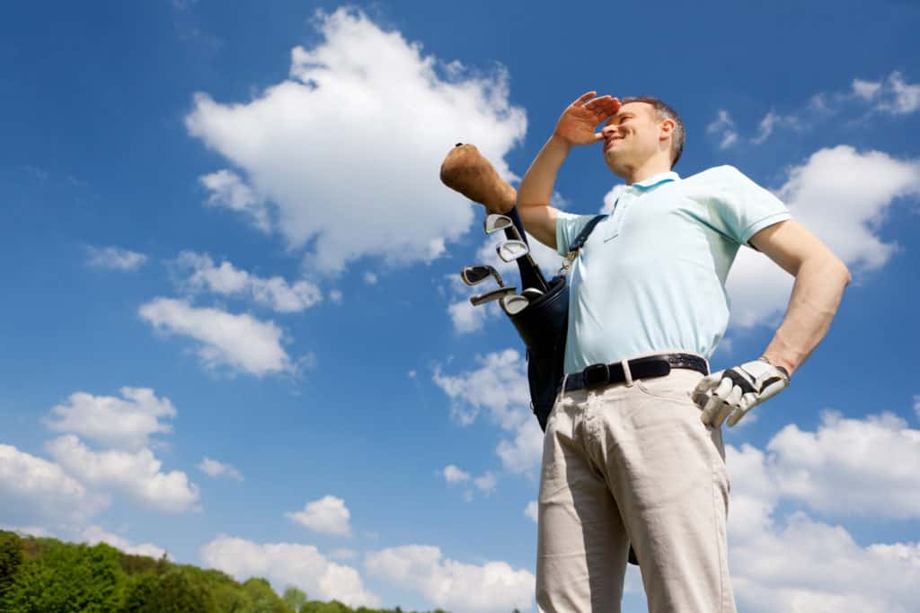 golfer against blue sky