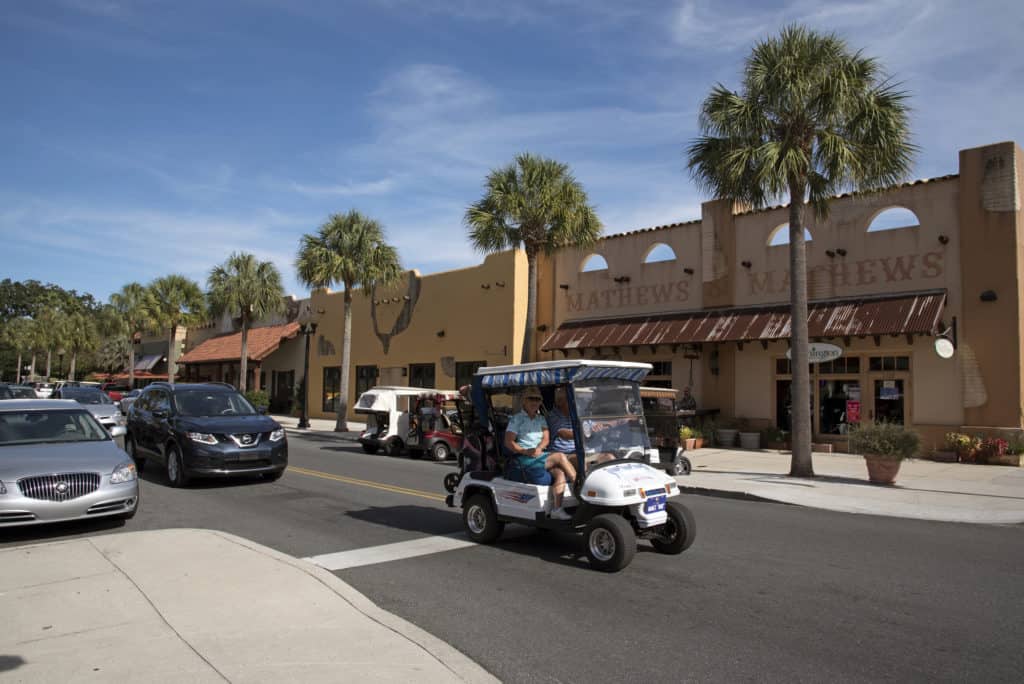 Spanish Springs town center Florida USA - October 2016 - Town center shops along a palm lined street