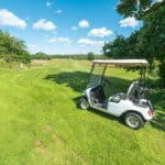 Summer Swedish golf course with golf cart