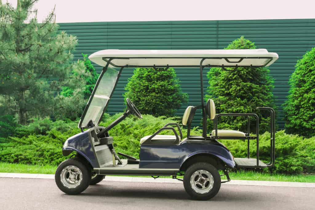 Modern cart on road in golf club