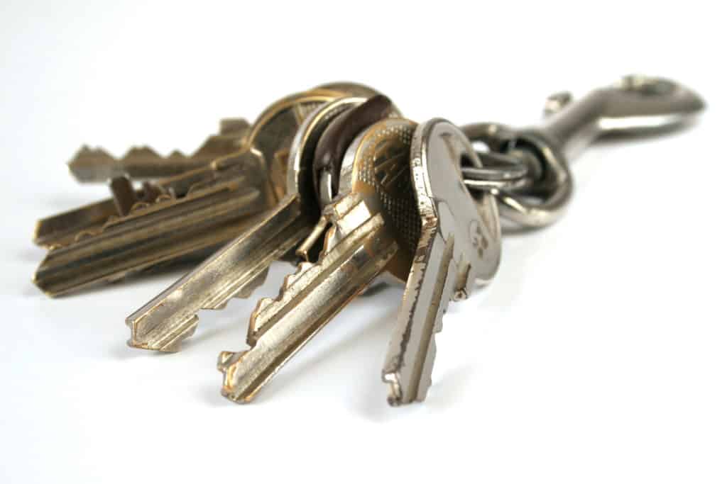 Bunch of keys with carabine isolated over white