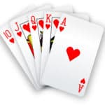 Royal straight flush playing cards poker hand in hearts